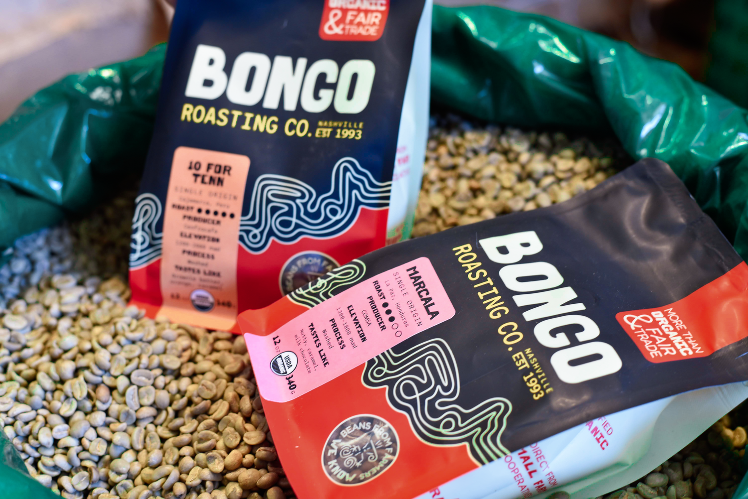 Bongo Roasting Co. coffee bags with coffee beans in a green bag